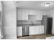This kitchen features new stainless steel appliances, updated cabinets, and countertops at 1432 Quarter Pt, Raleigh, NC 27615