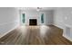 Spacious living room features hardwood floors, fireplace, and a ceiling fan at 1432 Quarter Pt, Raleigh, NC 27615