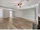 Open floor plan with wood floors, neutral walls, and lots of natural light at 1432 Quarter Pt, Raleigh, NC 27615
