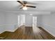 Bright and spacious living room with wood flooring, a ceiling fan, and neutral-painted walls at 1432 Quarter Pt, Raleigh, NC 27615