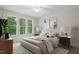 Cozy bedroom featuring a comfortable bed, large windows, and stylish nightstands at 146 Wood Wedge, Sanford, NC 27332