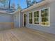 Home exterior with a spacious wooden deck and multiple windows that provide natural light indoors at 146 Wood Wedge, Sanford, NC 27332