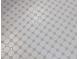 Detailed view of the bathroom's patterned tile flooring at 146 Wood Wedge, Sanford, NC 27332