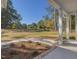 Inviting front yard features a lush green lawn and mature trees providing a sense of privacy at 146 Wood Wedge, Sanford, NC 27332