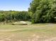 Scenic view of a meticulously maintained golf course surrounded by lush greenery at 146 Wood Wedge, Sanford, NC 27332
