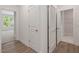 Bright hallway with wood floors, white doors, and views into the bedroom and closet at 146 Wood Wedge, Sanford, NC 27332