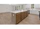 Spacious kitchen island with modern cabinets, white countertop, and stainless steel appliances in the background at 146 Wood Wedge, Sanford, NC 27332