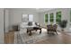 Bright living room with hardwood floors, a neutral rug, and large windows offering abundant natural light at 146 Wood Wedge, Sanford, NC 27332