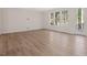 Open-concept space with hardwood floors, a door to a deck, and natural light at 146 Wood Wedge, Sanford, NC 27332