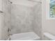Detailed view of the tiled shower featuring a bathtub and a showerhead at 146 Wood Wedge, Sanford, NC 27332