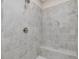Close-up of the tiled shower featuring a showerhead and a built-in seat at 146 Wood Wedge, Sanford, NC 27332