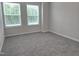 Neutral carpeted bedroom with natural light coming in from two large windows at 3006 Freewinds Way # 41, Cary, NC 27519