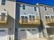 Townhouse exterior with private balcony and garage at 3006 Freewinds Way # 41, Cary, NC 27519