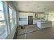 Modern kitchen with white cabinets and island at 3006 Freewinds Way # 41, Cary, NC 27519