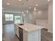 Kitchen island with stainless steel dishwasher, a sink and white countertops at 3006 Freewinds Way # 41, Cary, NC 27519