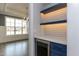 Stylish butler's pantry with custom cabinets, tile backsplash, and a wine fridge at 111 Gaines Trail, Pittsboro, NC 27312