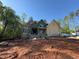 Unfinished two-story home exterior with yellow siding and visible construction progress at 111 Gaines Trail, Pittsboro, NC 27312
