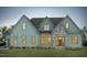 Charming home showcasing stone accents, a welcoming front door, and manicured landscaping at 111 Gaines Trail, Pittsboro, NC 27312