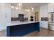 Modern kitchen with stainless steel appliances, custom cabinets, and a large center island at 111 Gaines Trail, Pittsboro, NC 27312