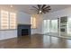 Inviting living room featuring a fireplace, built-in bookshelves, and hardwood floors at 111 Gaines Trail, Pittsboro, NC 27312