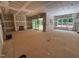 Spacious living room with sliding glass doors, fireplace, and drywall ready for customization at 111 Gaines Trail, Pittsboro, NC 27312