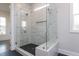 Modern bathroom featuring a glass enclosed walk-in shower with a built-in seat at 111 Gaines Trail, Pittsboro, NC 27312