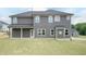 Two-story house featuring gray siding, a covered porch, multiple windows and a well-maintained lawn at 136 Newport Lndg, Garner, NC 27529