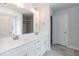 Bathroom features double vanity, white cabinets, chrome fixtures, and a tiled floor at 136 Newport Lndg, Garner, NC 27529