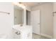 Bathroom featuring a white vanity with a framed mirror, modern lighting, and brushed nickel hardware at 136 Newport Lndg, Garner, NC 27529