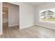 Bright bedroom with a large window and light wood floors, creating a serene and inviting space at 136 Newport Lndg, Garner, NC 27529