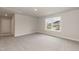 Spacious carpeted bedroom features a large window offering bright, natural light at 136 Newport Lndg, Garner, NC 27529