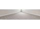 Corner of a carpeted bedroom featuring neutral colors, base molding, and several electrical outlets at 136 Newport Lndg, Garner, NC 27529