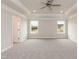 Large bedroom with tray ceiling, recessed lighting, and natural light from two windows at 136 Newport Lndg, Garner, NC 27529
