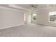 Bright bedroom with tray ceiling, recessed lighting, and neutral gray carpet at 136 Newport Lndg, Garner, NC 27529
