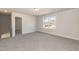 Upstairs bonus room with natural light and carpet floors at 136 Newport Lndg, Garner, NC 27529