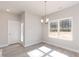 Cozy dining area with ample light, featuring wood floors and neutral decor at 136 Newport Lndg, Garner, NC 27529