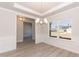 Dining area with a view, wood floors, and modern chandelier lighting at 136 Newport Lndg, Garner, NC 27529
