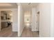 Bright hallway with wood floors leading to various rooms in the house at 136 Newport Lndg, Garner, NC 27529