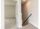 Upstairs hallway features carpeted stairs and access to bedrooms at 136 Newport Lndg, Garner, NC 27529
