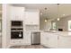 Kitchen featuring stainless steel appliances, white cabinetry, and quartz countertops at 136 Newport Lndg, Garner, NC 27529