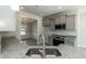 A well-equipped kitchen features granite countertops, stainless steel appliances, and gray cabinets at 136 Newport Lndg, Garner, NC 27529