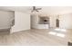 Open-concept living room featuring hardwood floors and seamlessly connected to the kitchen at 136 Newport Lndg, Garner, NC 27529