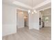 Spacious living room with wood floors, adjacent to the kitchen and dining area, creating an open concept feel at 136 Newport Lndg, Garner, NC 27529