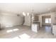 Open-concept living area with fireplace, kitchen, and dining space, perfect for entertaining at 136 Newport Lndg, Garner, NC 27529