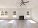 Bright living room features a fireplace, wood-look floors, and natural light at 136 Newport Lndg, Garner, NC 27529