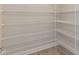 Walk-in pantry with wire shelving and ample storage space at 136 Newport Lndg, Garner, NC 27529
