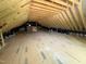Spacious attic with exposed wood beams and insulation, offering potential for extra living space at 162 Gaines Trail, Pittsboro, NC 27312