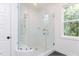 Bathroom featuring glass shower with white tiling at 162 Gaines Trail, Pittsboro, NC 27312