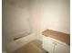 Unfinished bathroom featuring a white tub, shower, and vanity at 162 Gaines Trail, Pittsboro, NC 27312