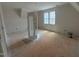 Upstairs bedroom with large window and unfinished closet at 162 Gaines Trail, Pittsboro, NC 27312